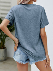 Misty Blue heathered t-shirt with short sleeves and a crew neck, styled with denim shorts.