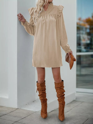 Apricot ruffled notched sleeve dress with V-neck and cinched waist, styled with brown boots.