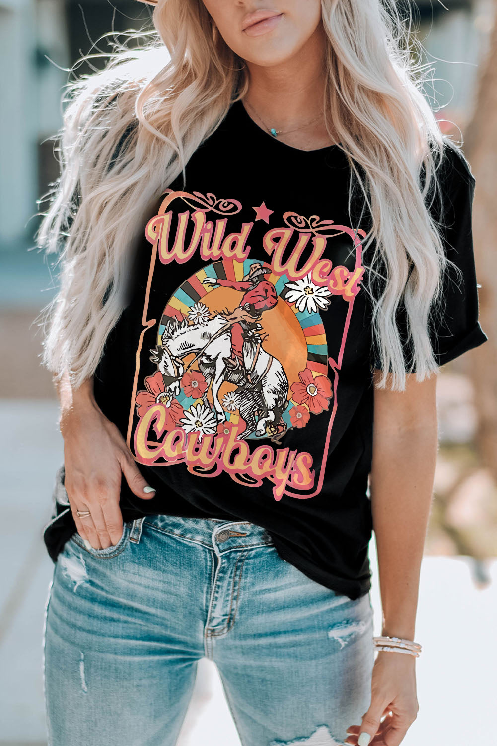 Black Wild West graphic t-shirt with cowboy, horse, flowers and retro sunset design.
