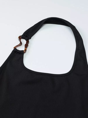Black ribbed halter tank top with scoop neck and tortoiseshell ring detail.