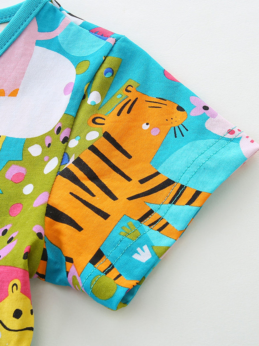 Toddler dress with vibrant safari print, featuring a tiger and animal graphics on cotton fabric.