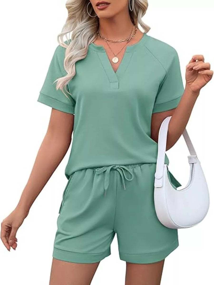 Green relaxed two-piece set with v-neck top and drawstring shorts with pockets