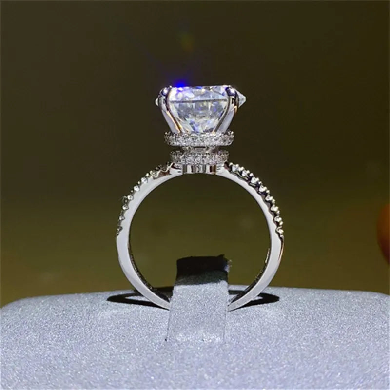 Sterling silver ring with a large solitaire diamond and pave band.