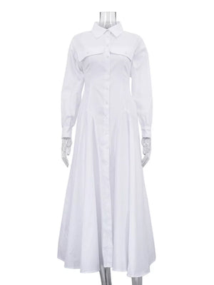 White cotton shirt dress with long sleeves, pointed collar, button front, and full skirt.