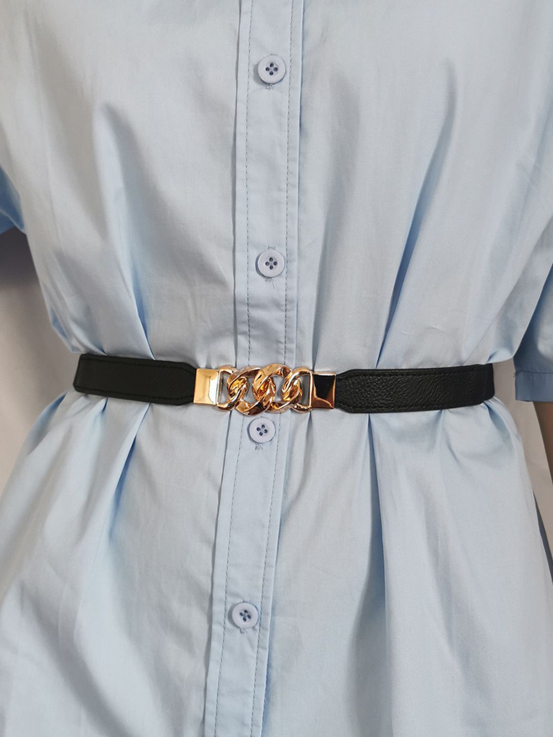 Black faux leather belt with gold chain detail and buckle