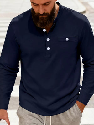 Navy blue long sleeve band collar shirt with button detail and chest pocket