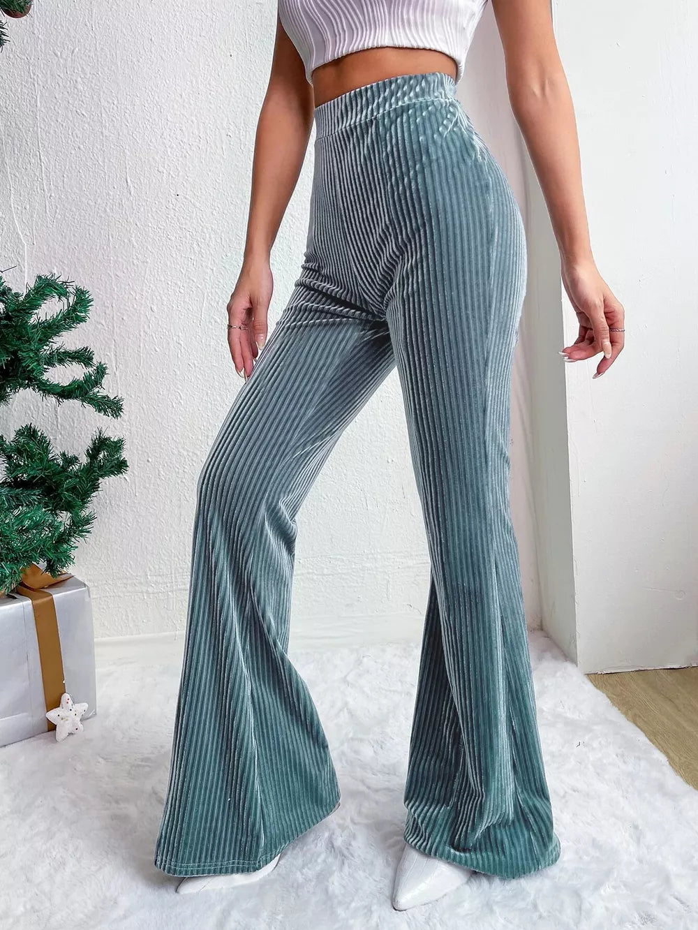 Peacock Blue corduroy high-waist flare maternity pants with vertical ribbing.