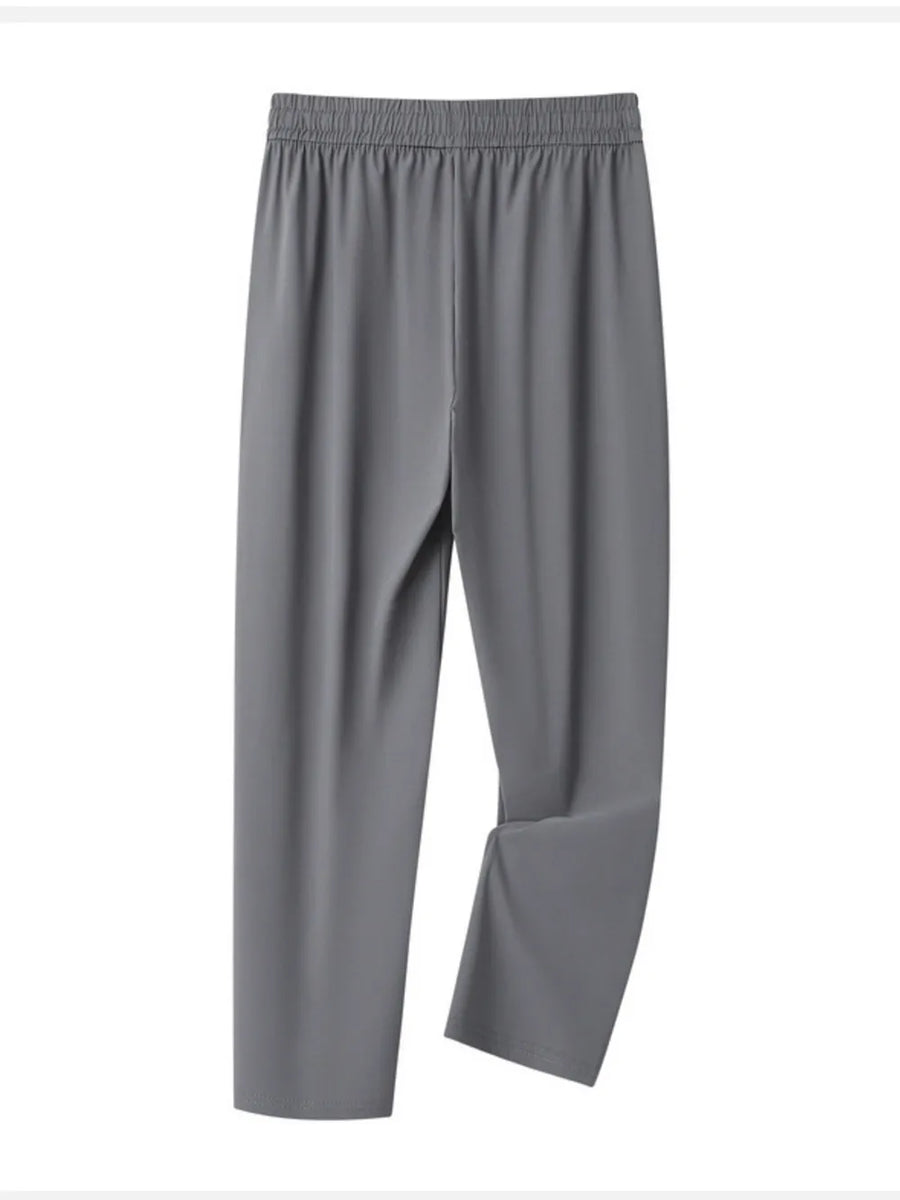 Grey sweatpants with elastic waistband and drawstring, relaxed fit for men.