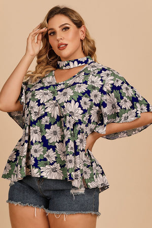 Dark blue floral peplum blouse with keyhole neckline and flutter sleeves.