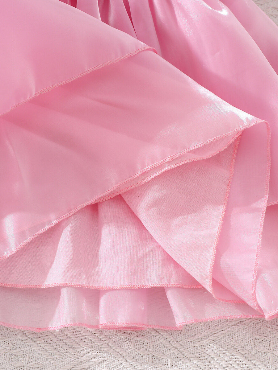 Pink baby dress with tiered skirt and ruffled hem detail.