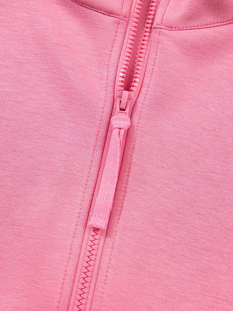 Dusty pink zip-up hoodie detail with textured zipper pull and fabric.