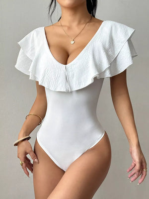 bodysuit in white featuring ruffled and fitted fit