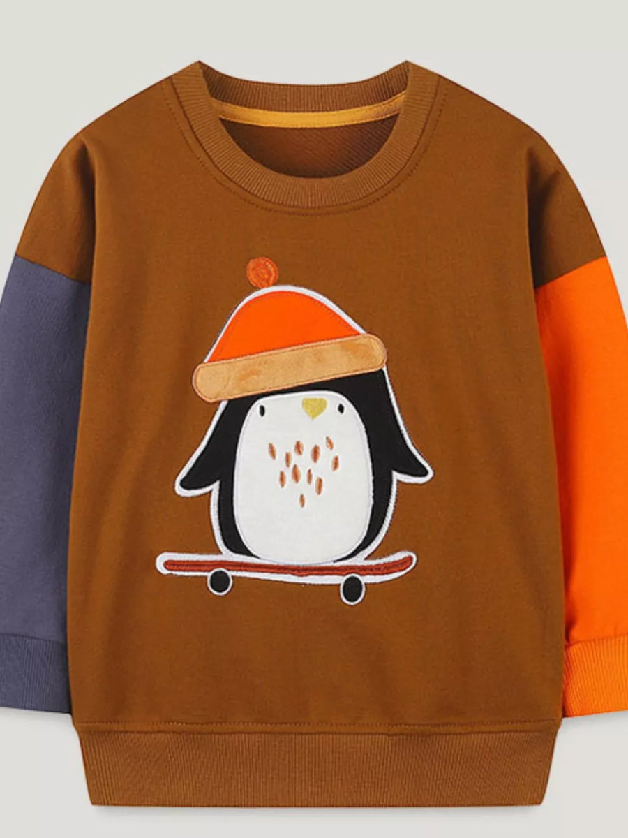 Toddler color-block sweatshirt with penguin appliqué on skateboard.