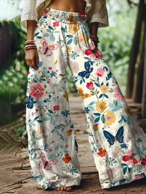wide-leg pants in cream featuring elastic waist and flared fit
