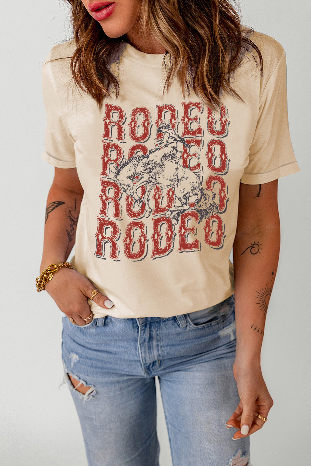 Light Apricot crewneck tee with a distressed rodeo graphic print.