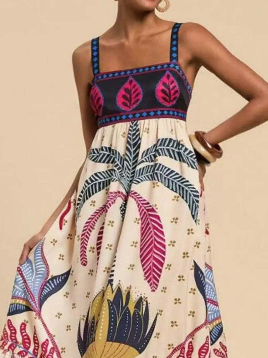 Tropical maxi dress with square neck and bold leaf print.