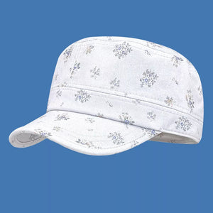White cadet cap with a subtle blue floral print and a curved brim.