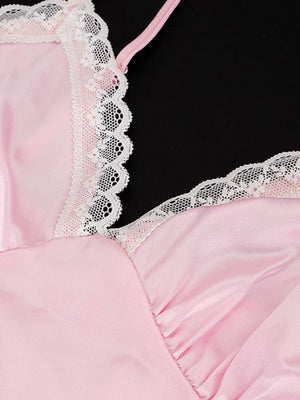 Pink satin camisole with delicate white lace trim and asymmetrical neckline.