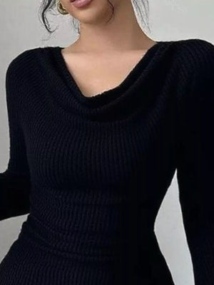 Black ribbed cowl neck top with asymmetrical neckline and long sleeves.