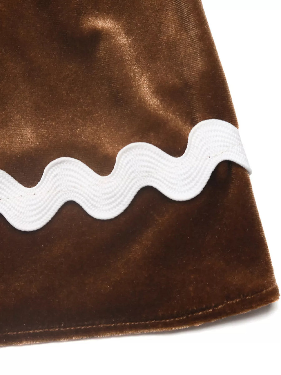 Brown velvet midi skirt with white ric-rac trim detail.