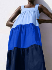 Three-tone wide strap dress with square neckline and tiered skirt in light blue, royal blue, and navy.