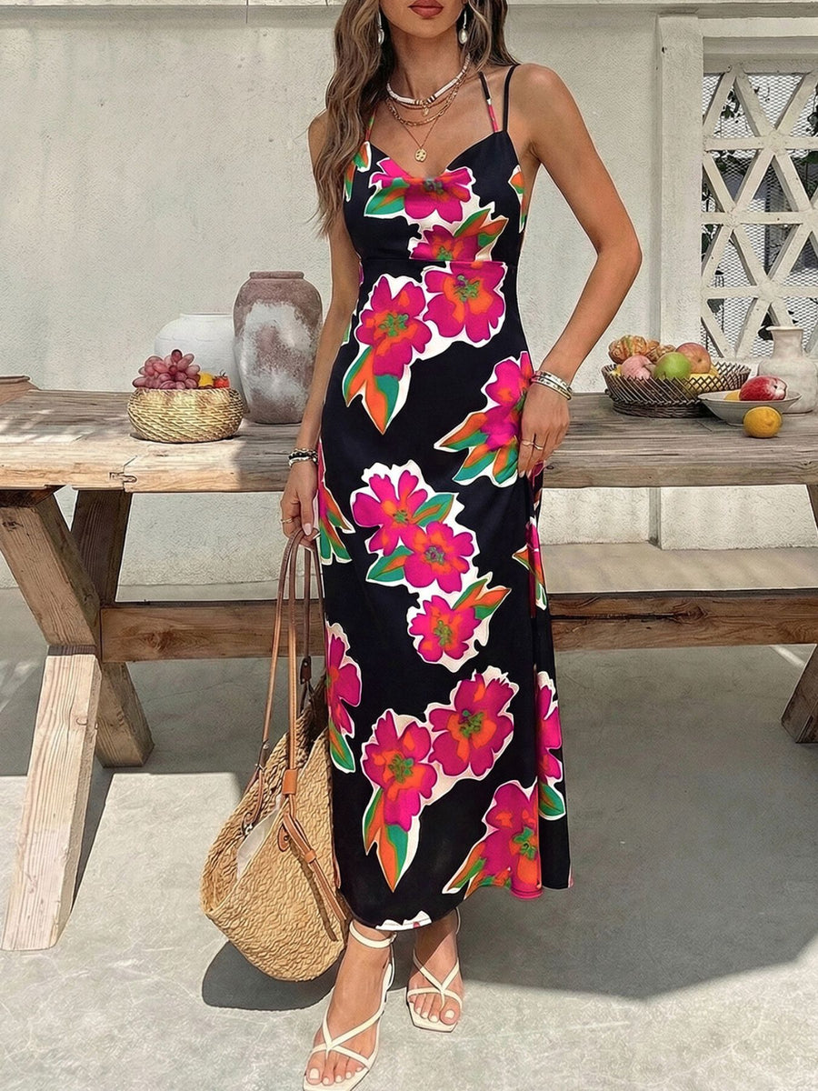 Vibrant floral midi dress with spaghetti straps in black with pink and orange flowers.