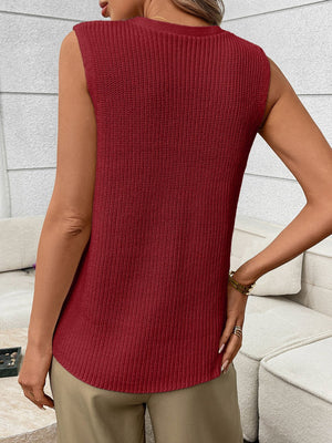 Burgundy knit sweater vest with ribbed texture and curved hem.