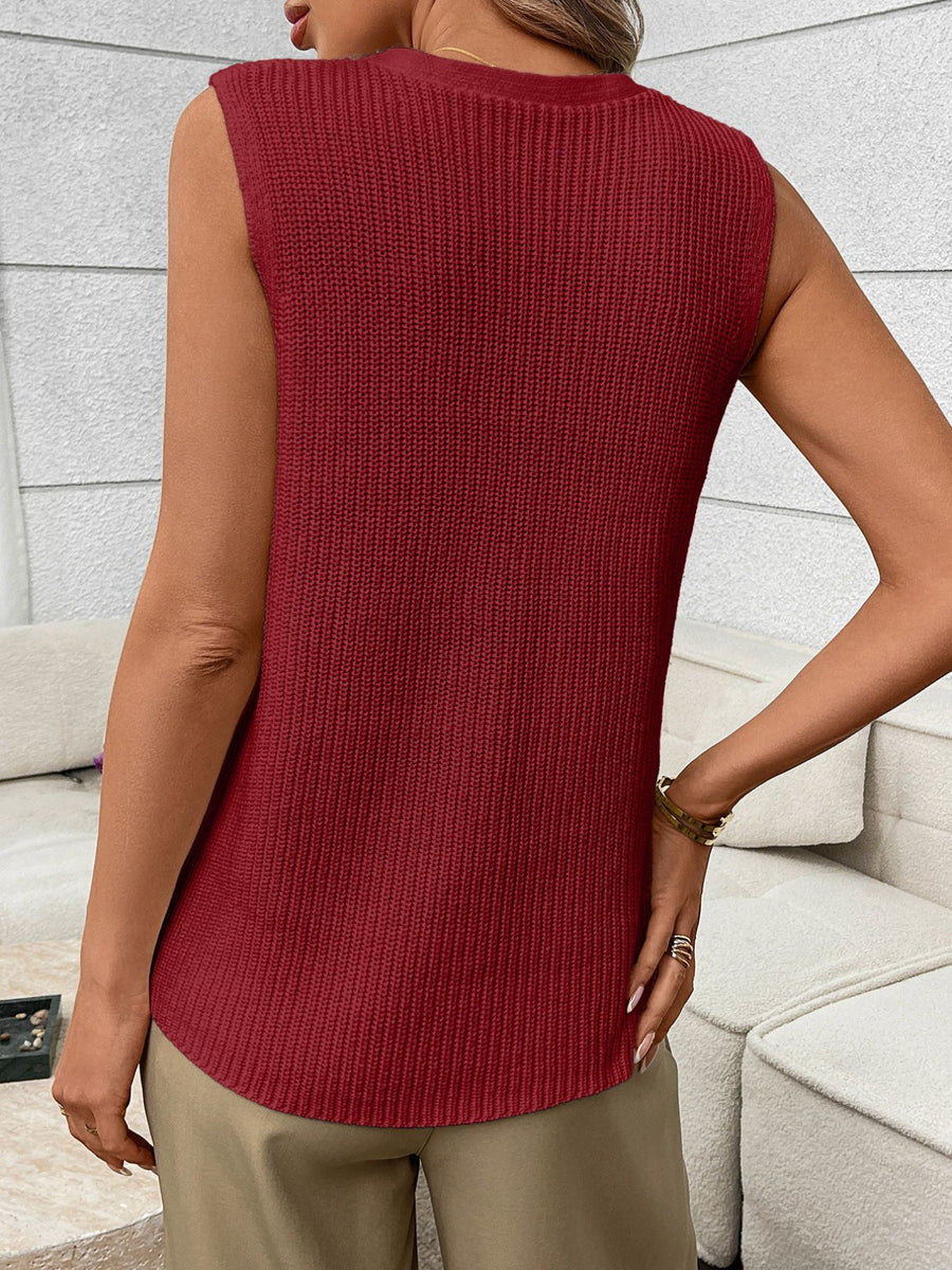 Burgundy knit sweater vest with ribbed texture and curved hem.