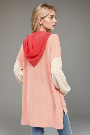 Pink ribbed hooded tunic with contrasting sleeves and hood
