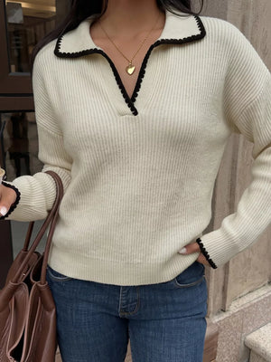 pullover sweater in cream featuring dropped shoulder and relaxed fit