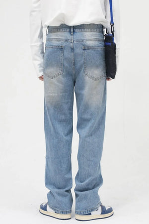 Faded wash relaxed fit jeans in medium blue denim with a casual, breathable feel.