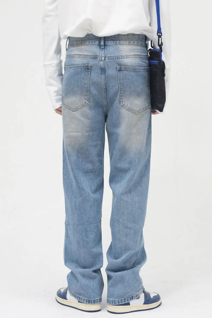 Faded wash relaxed fit jeans in medium blue denim with a casual, breathable feel.