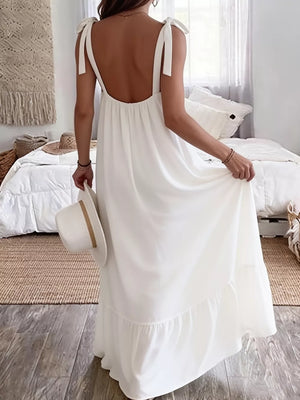 White tie strap maxi dress with a tiered hem and open back.