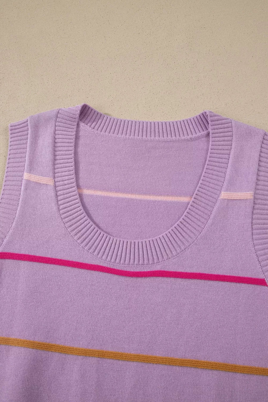 Lavender knit sweater vest with colorful horizontal stripes and crew neck.