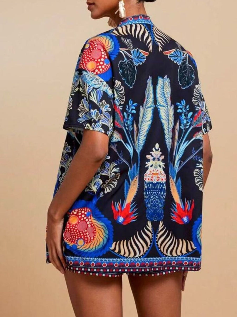 Navy tropical print cardigan with short sleeves and drawstring shorts.