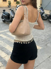 Crochet knit cami vest with openwork detail and coin trim, worn with black shorts.