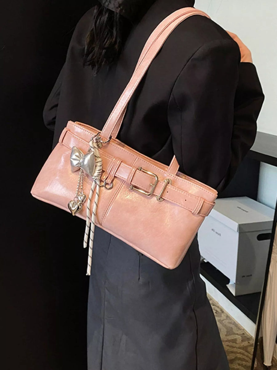 Blush pink shoulder bag with buckle detail and heart charm