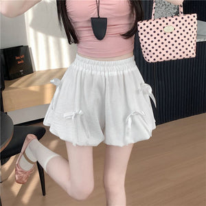 White bubble skirt with high waist and bowknot details.