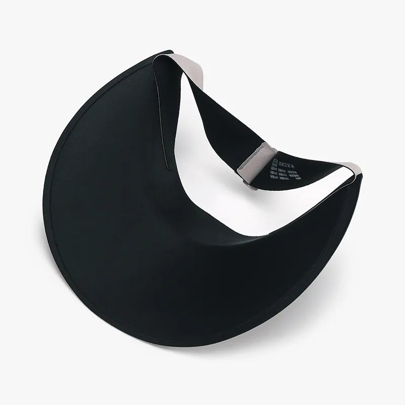 Black sculptural visor sun shield with adjustable strap and curved brim.