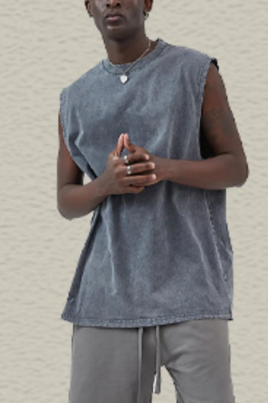 Acid wash muscle tank top in dark gray with a crew neck and sleeveless cut.