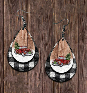 Festive plaid car drop earrings with red truck and Christmas tree detail.