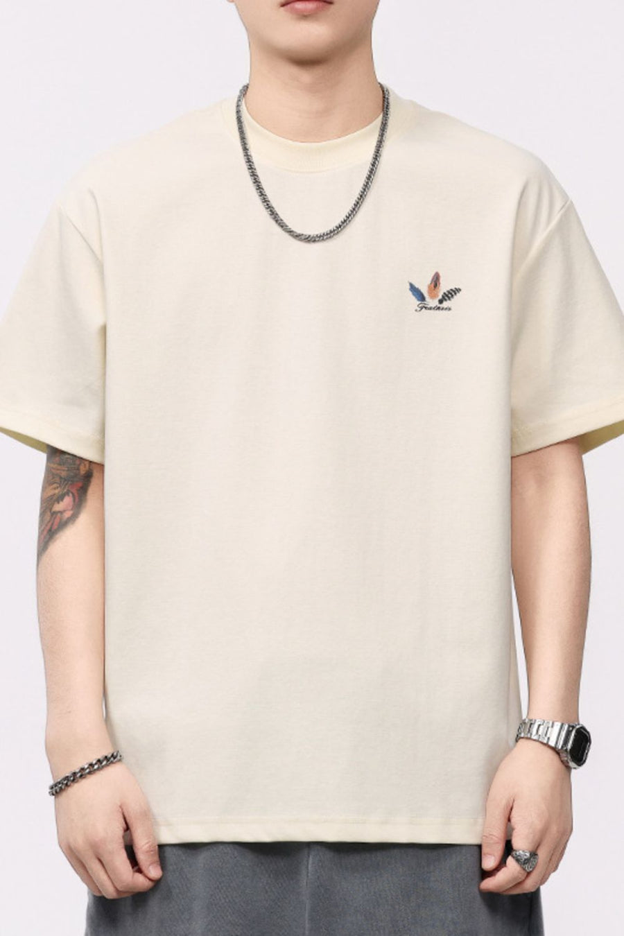 Cream cotton blend crew neck t-shirt with small feather print detail