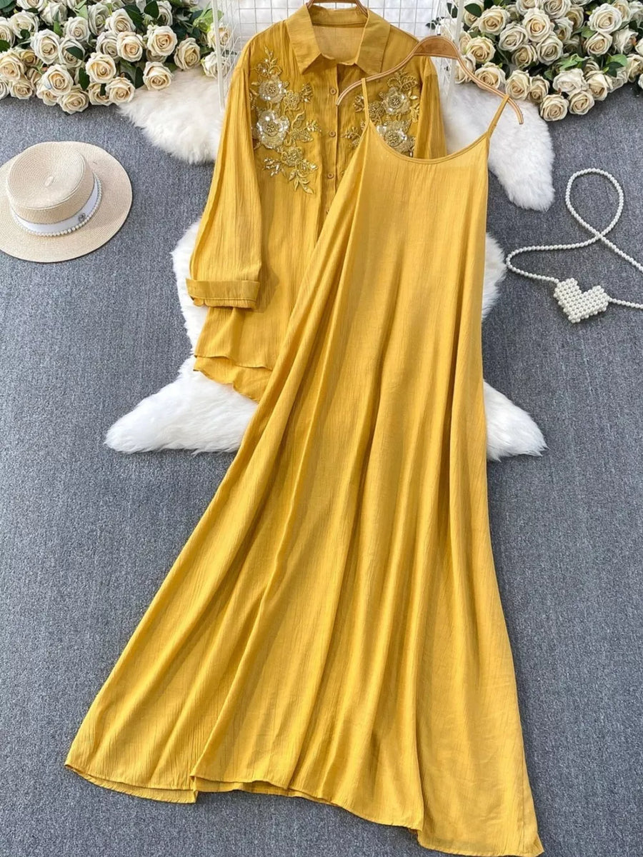 Yellow embroidered floral two-piece set with collared shirt and spaghetti strap dress.