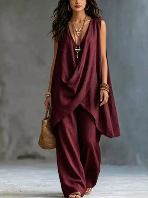 Burgundy asymmetrical draped top and wide-leg pants set in polyester.