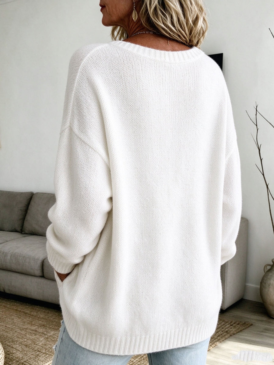 100% polyester Care instructions: Machine wash cold pullover sweater in ivory with relaxed silhouette