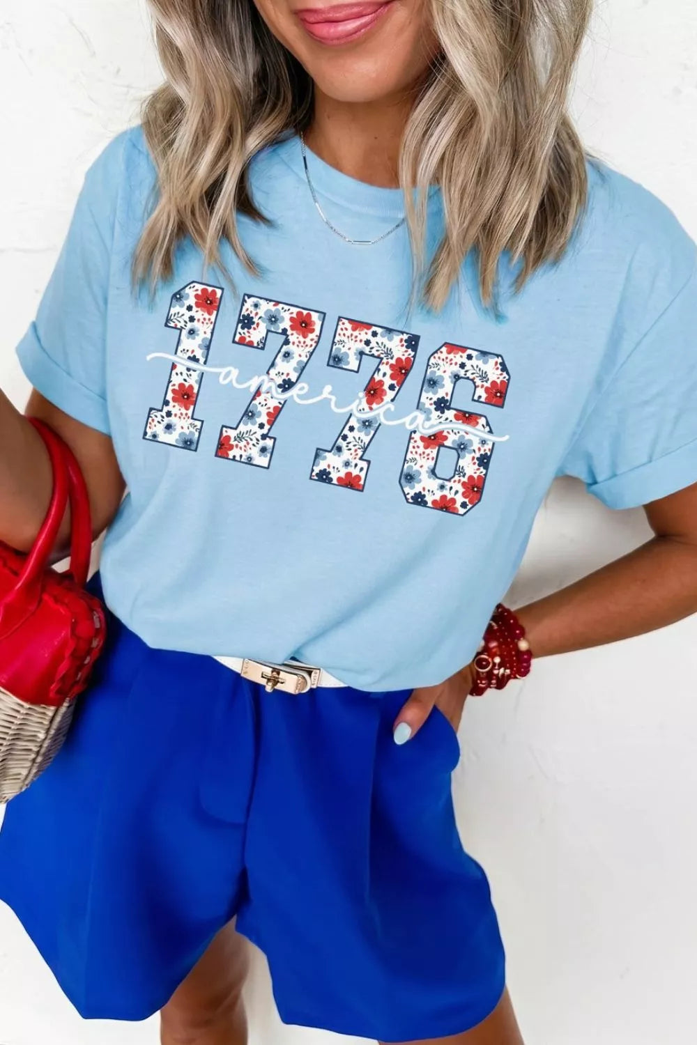 Light blue cotton t-shirt with floral 1776 graphic and short sleeves