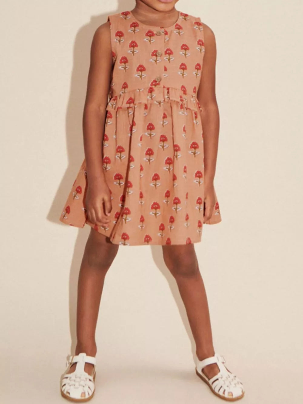 Toddler girls' peach cotton dress with red floral print, button front, and ruffled waist.