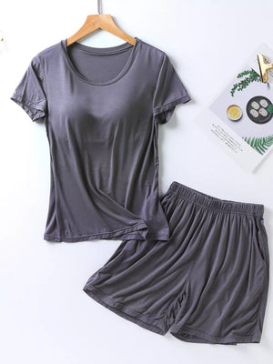 Heather gray two-piece pajama set with short sleeves, crew neck, and elastic waistband shorts with pockets.