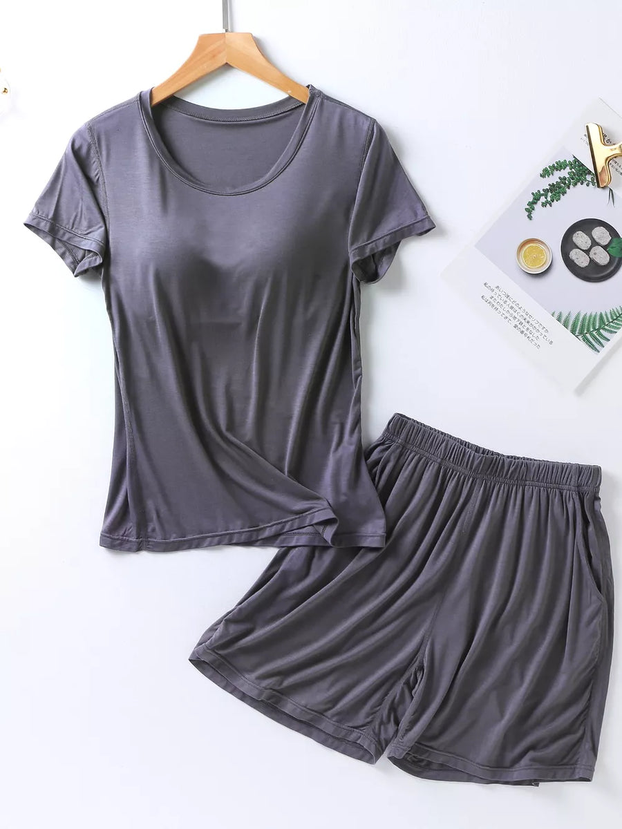 Heather gray two-piece pajama set with short sleeves, crew neck, and elastic waistband shorts with pockets.