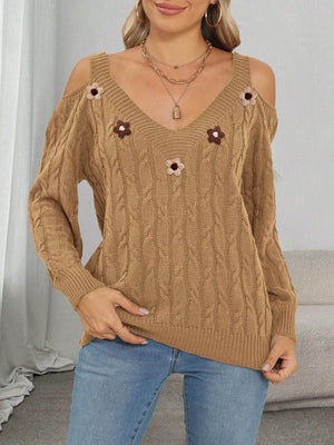 pullover sweater in black with cable knit and applique
